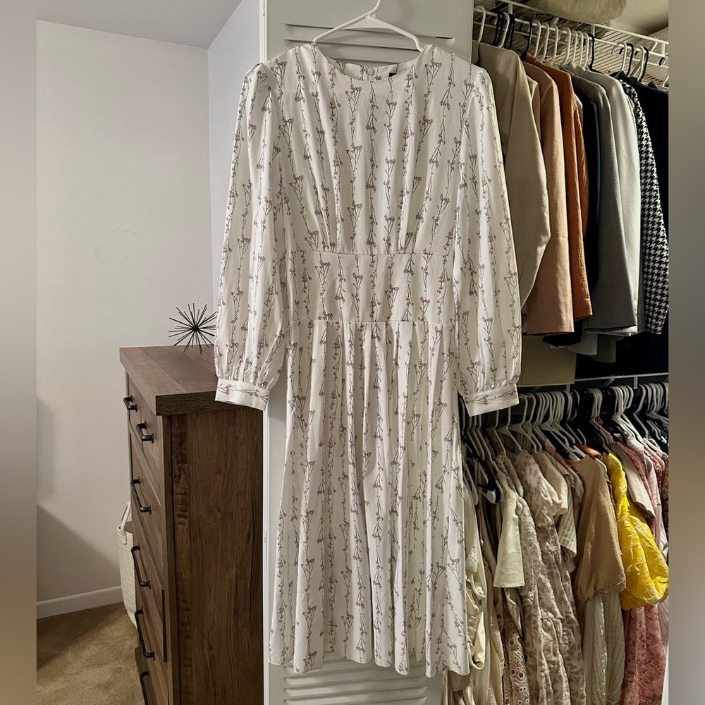 Brand new Simplee mid length floral pattern dress with belt.